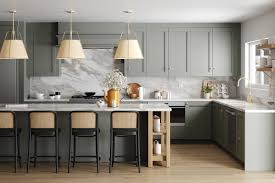 Sage green shaker kitchen with marble backsplash — Laniworks Construction North Vancouver